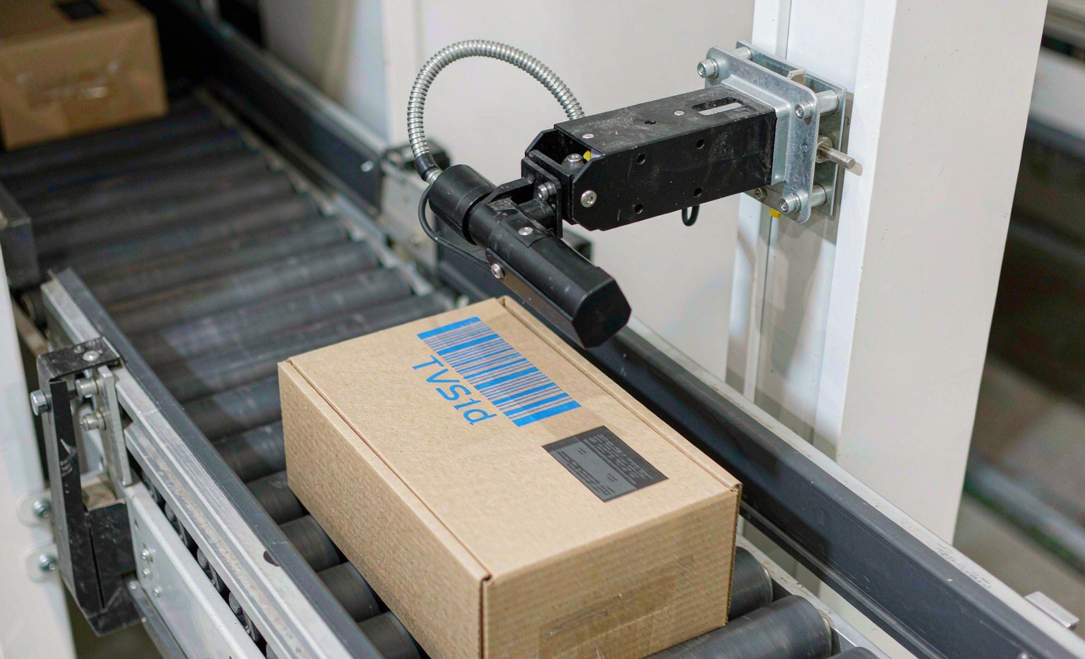 Omni-directional barcode and OCR scanner reading a parcel